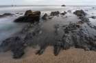Spain, Playa de Portizuelo. Rock formations on ocean shore. Art Print